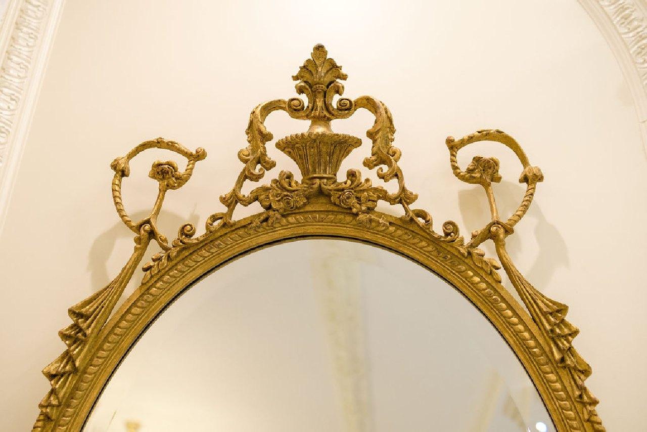 Beveled mirror Oval w/crest, rope and swag carving