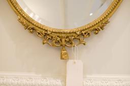 Beveled mirror Oval w/crest, rope and swag carving