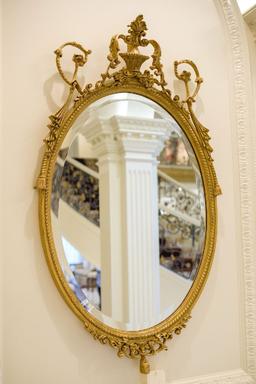 Beveled mirror Oval w/crest, rope and swag carving