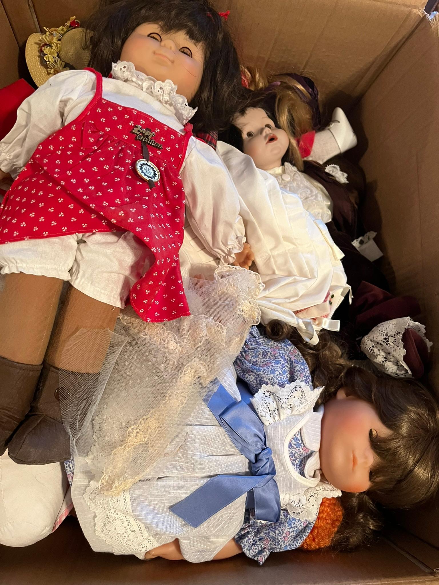 (4) Boxes of Assorted Dolls, Doll Clothing, etc.