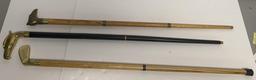 THREE FIGURAL HEADED WALKING STICKS