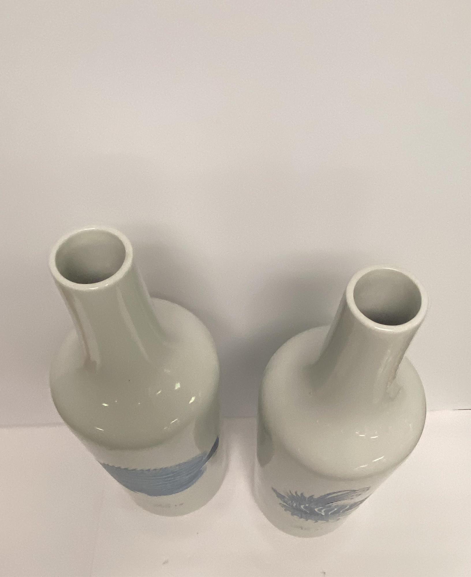 PAIR OF LARGE CERAMIC BOTTLES WITH NAUTICAL THEME