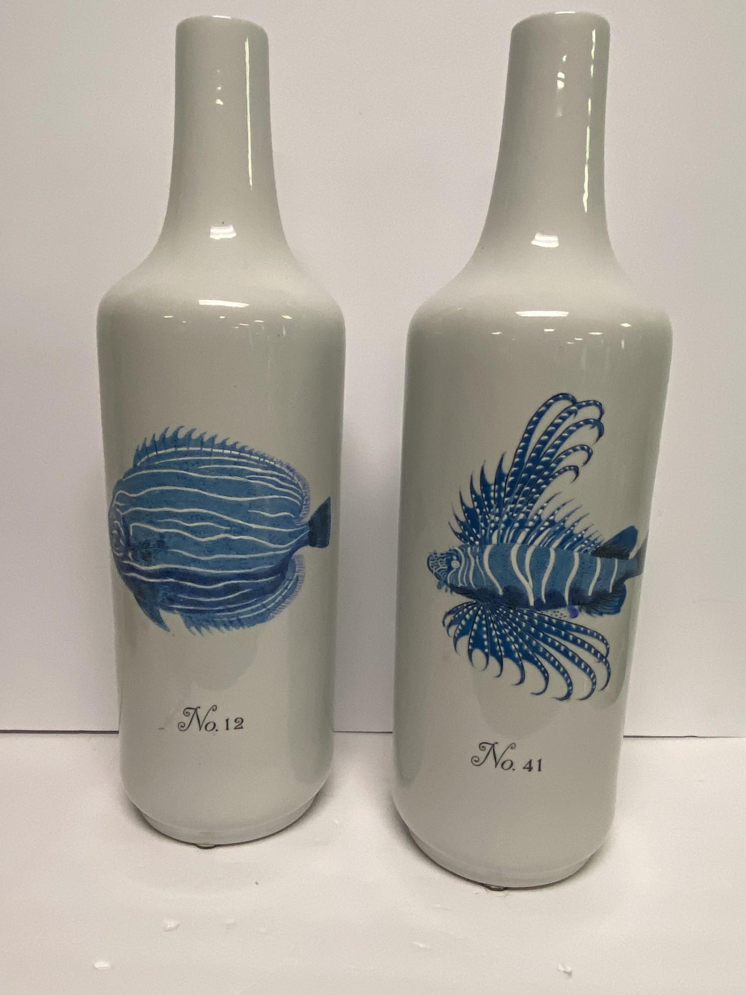 PAIR OF LARGE CERAMIC BOTTLES WITH NAUTICAL THEME