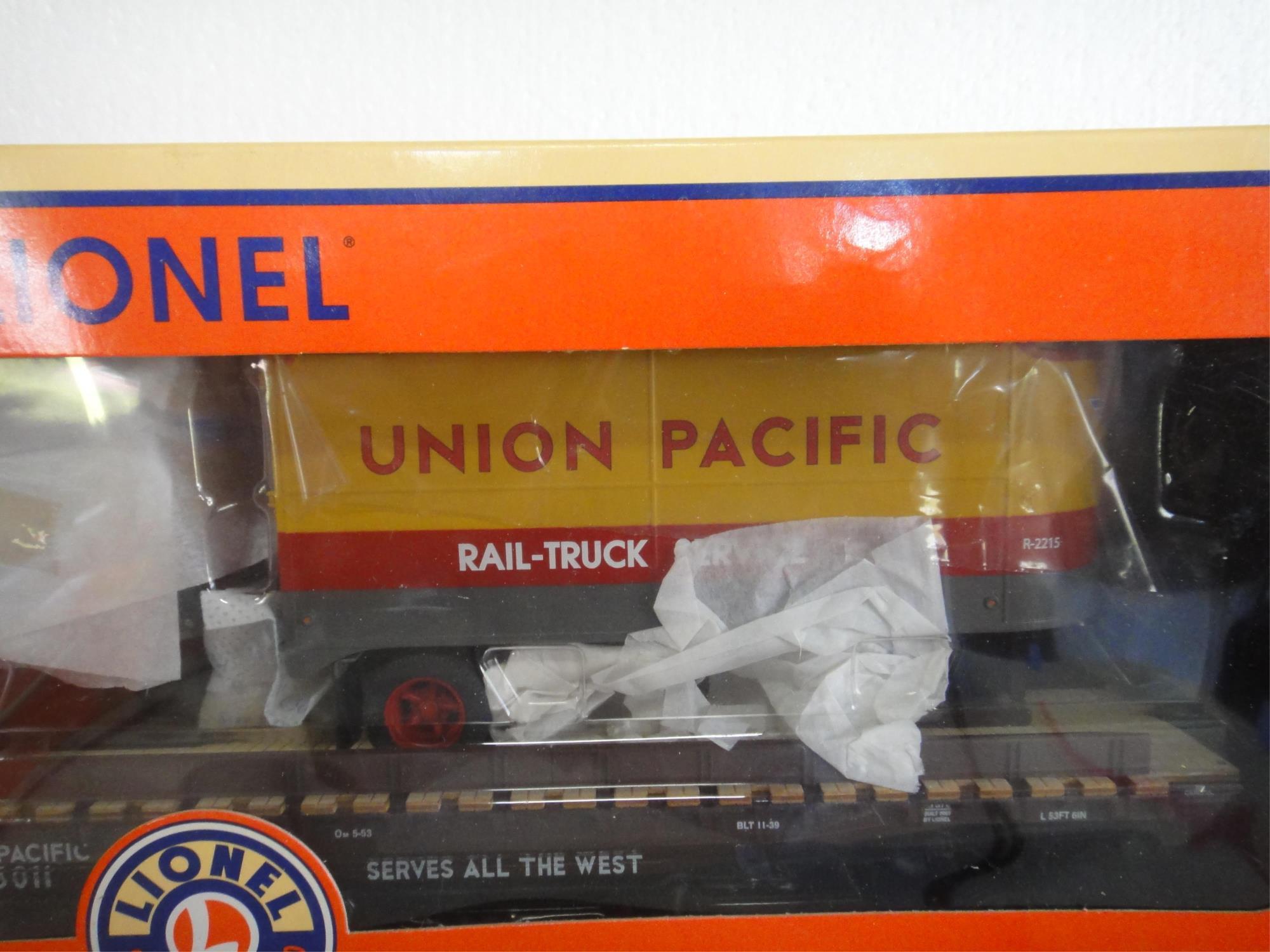 3 LIONEL FLATCARS WITH TRAILERS