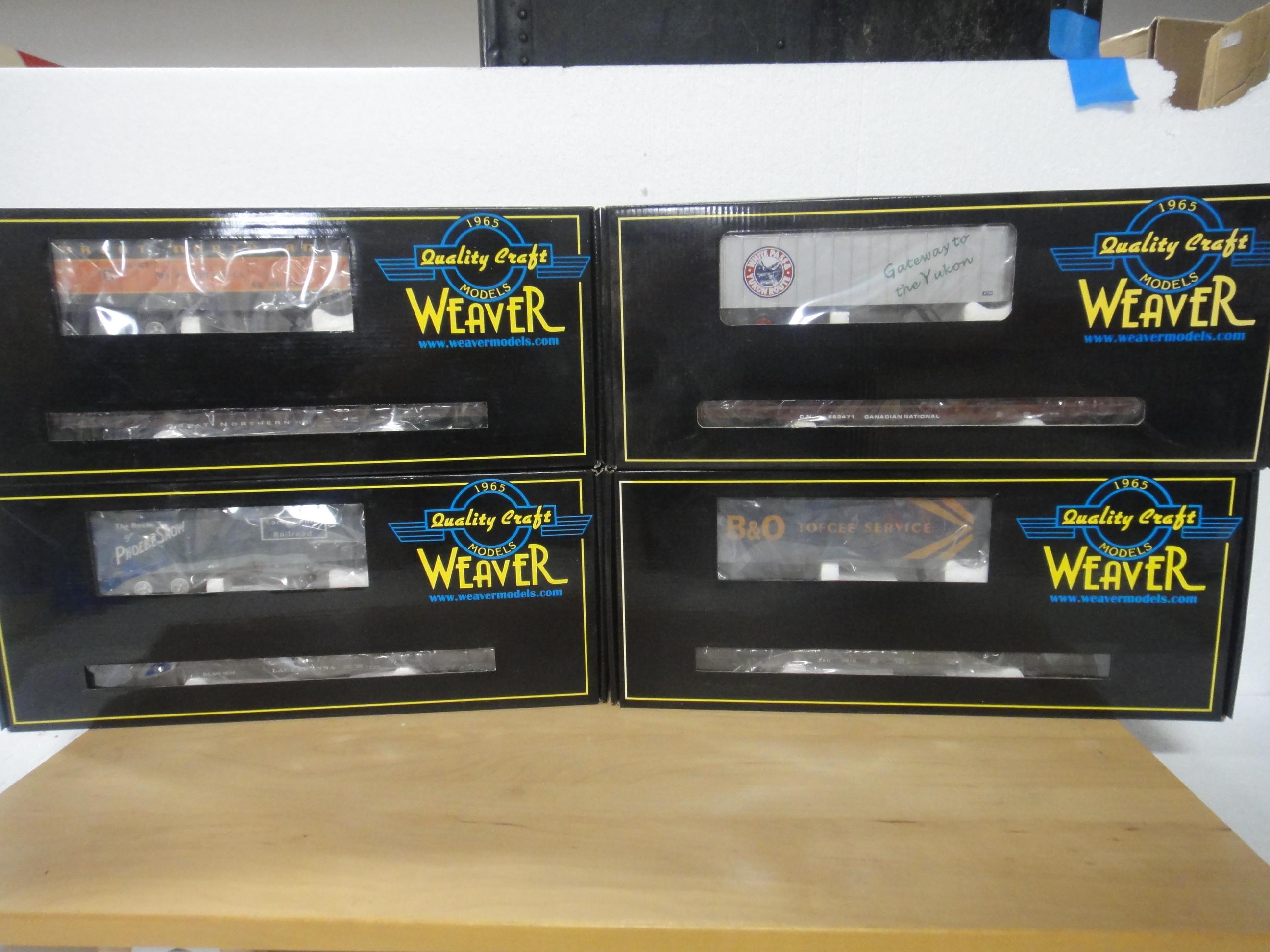 4 WEAVER   3 RAIL O GAUGE 50' FLAT CARS WITH 35' T