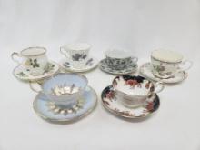 SIX VARIOUS MAKER CUPS AND SAUCERS