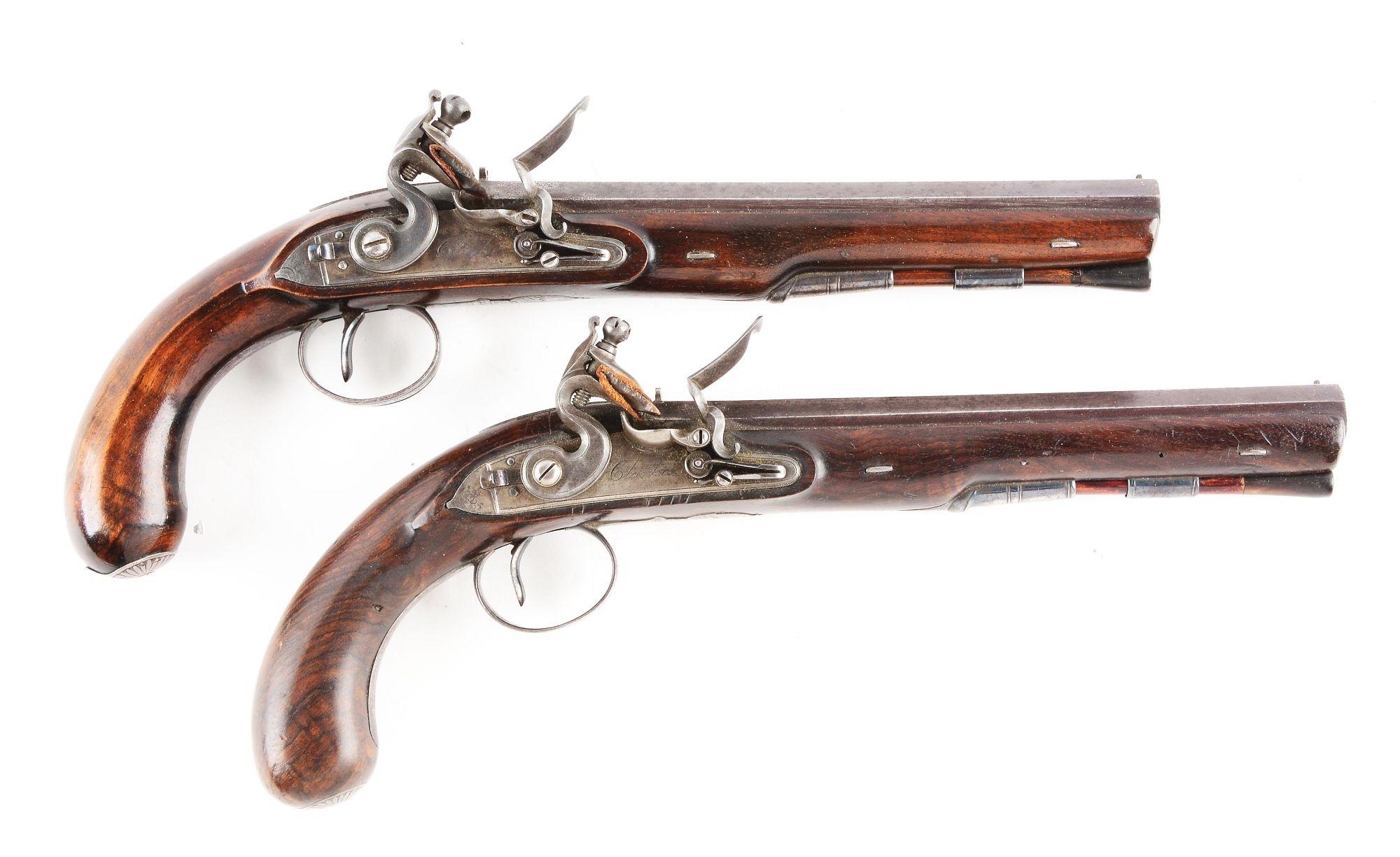 (A) Cased Pair of Flintlock Dueling Pistols by Clarke of Dublin.