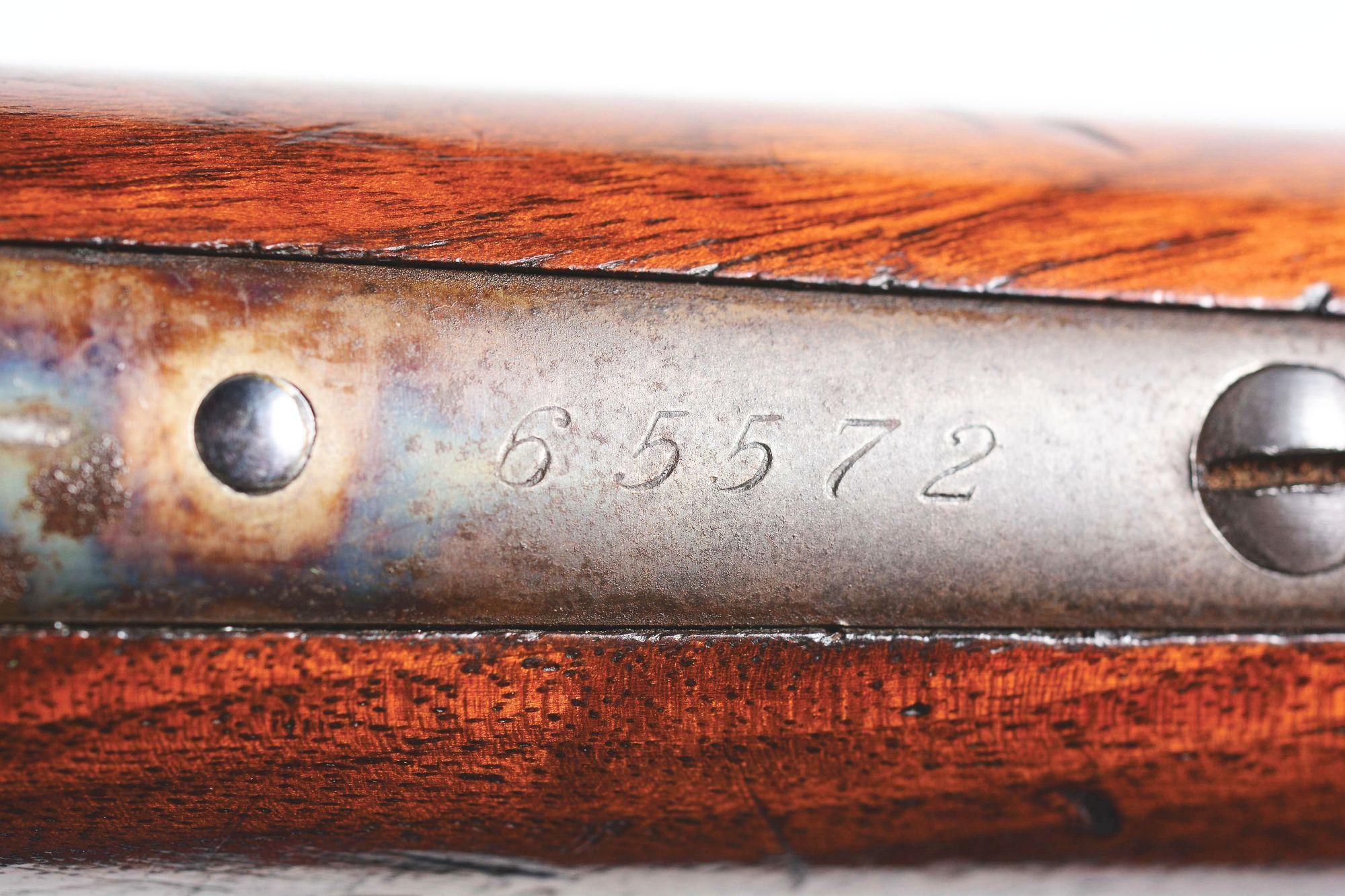 (A) Deluxe Winchester Model 1886 Lever Action Rifle.