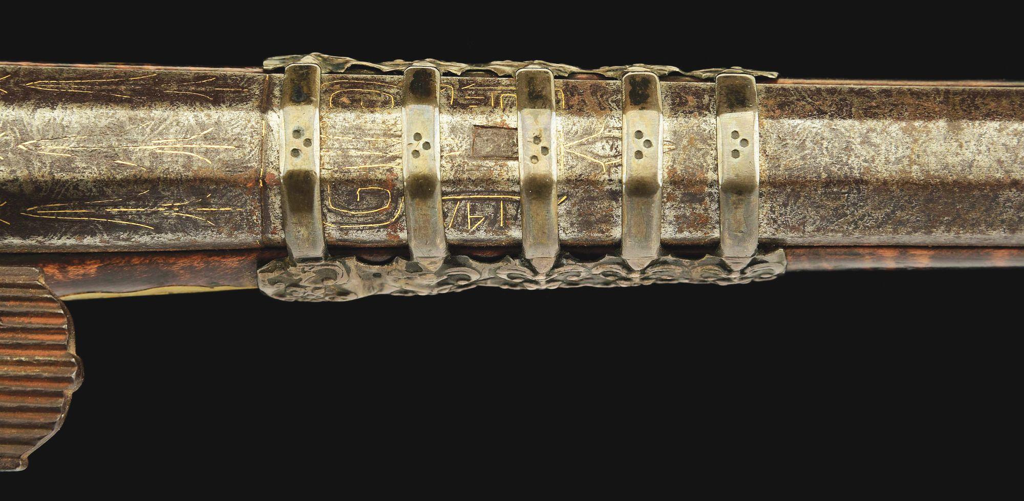 (A) AN ATTRACTIVE AND HIGHLY DECORATED CAUCASIAN MIQUELET LOCK RIFLE.