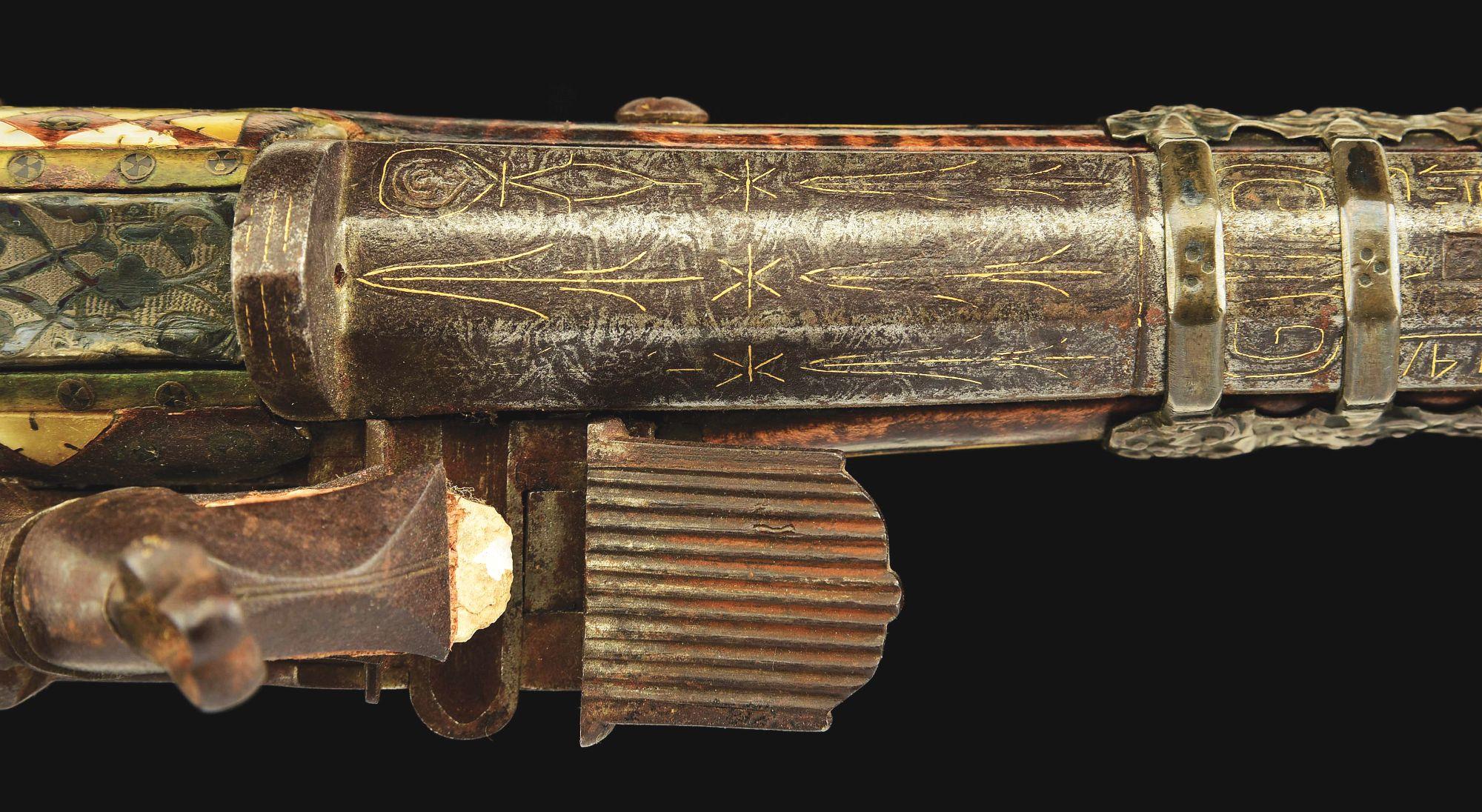 (A) AN ATTRACTIVE AND HIGHLY DECORATED CAUCASIAN MIQUELET LOCK RIFLE.