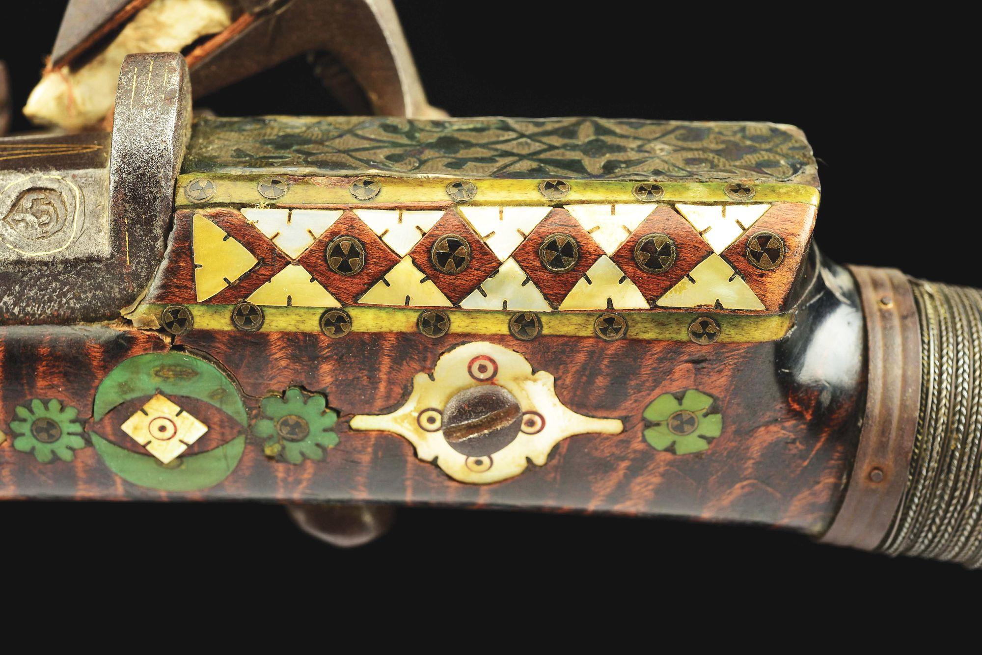 (A) AN ATTRACTIVE AND HIGHLY DECORATED CAUCASIAN MIQUELET LOCK RIFLE.