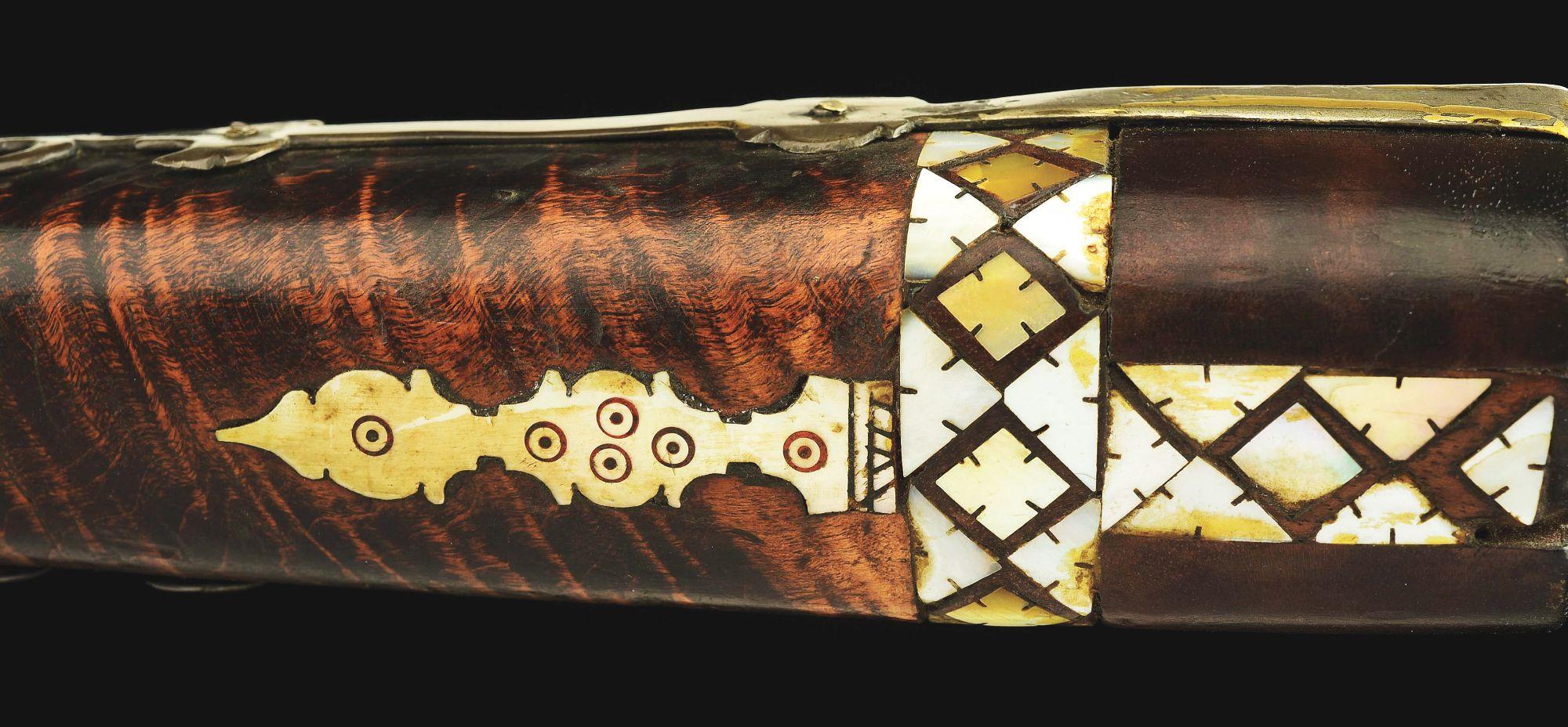 (A) AN ATTRACTIVE AND HIGHLY DECORATED CAUCASIAN MIQUELET LOCK RIFLE.