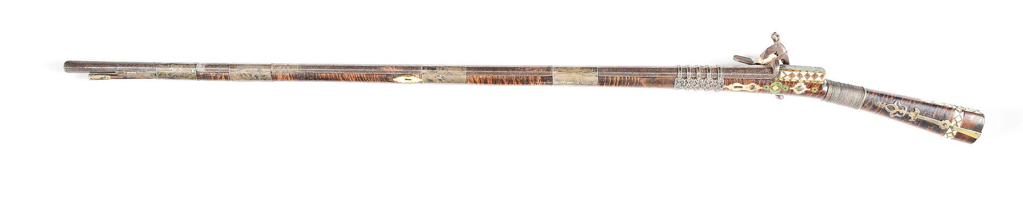 (A) AN ATTRACTIVE AND HIGHLY DECORATED CAUCASIAN MIQUELET LOCK RIFLE.