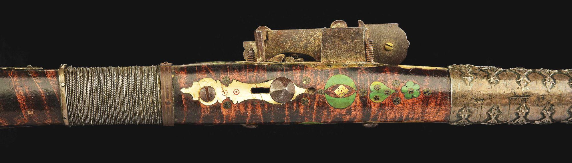 (A) AN ATTRACTIVE AND HIGHLY DECORATED CAUCASIAN MIQUELET LOCK RIFLE.