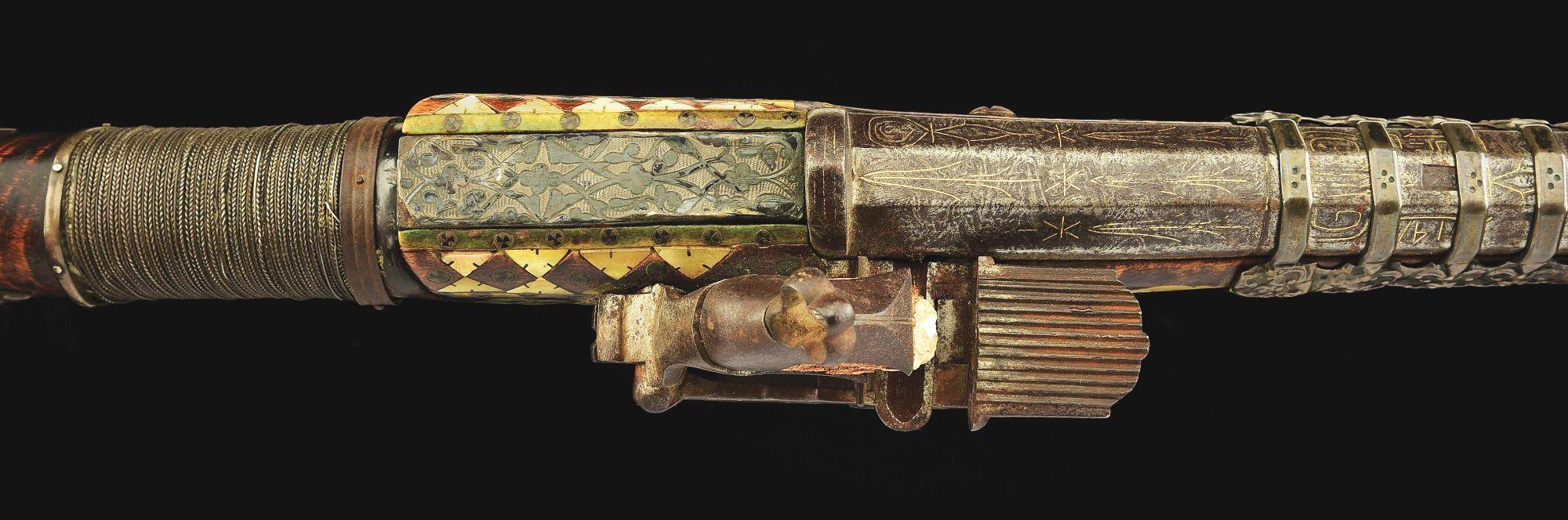 (A) AN ATTRACTIVE AND HIGHLY DECORATED CAUCASIAN MIQUELET LOCK RIFLE.