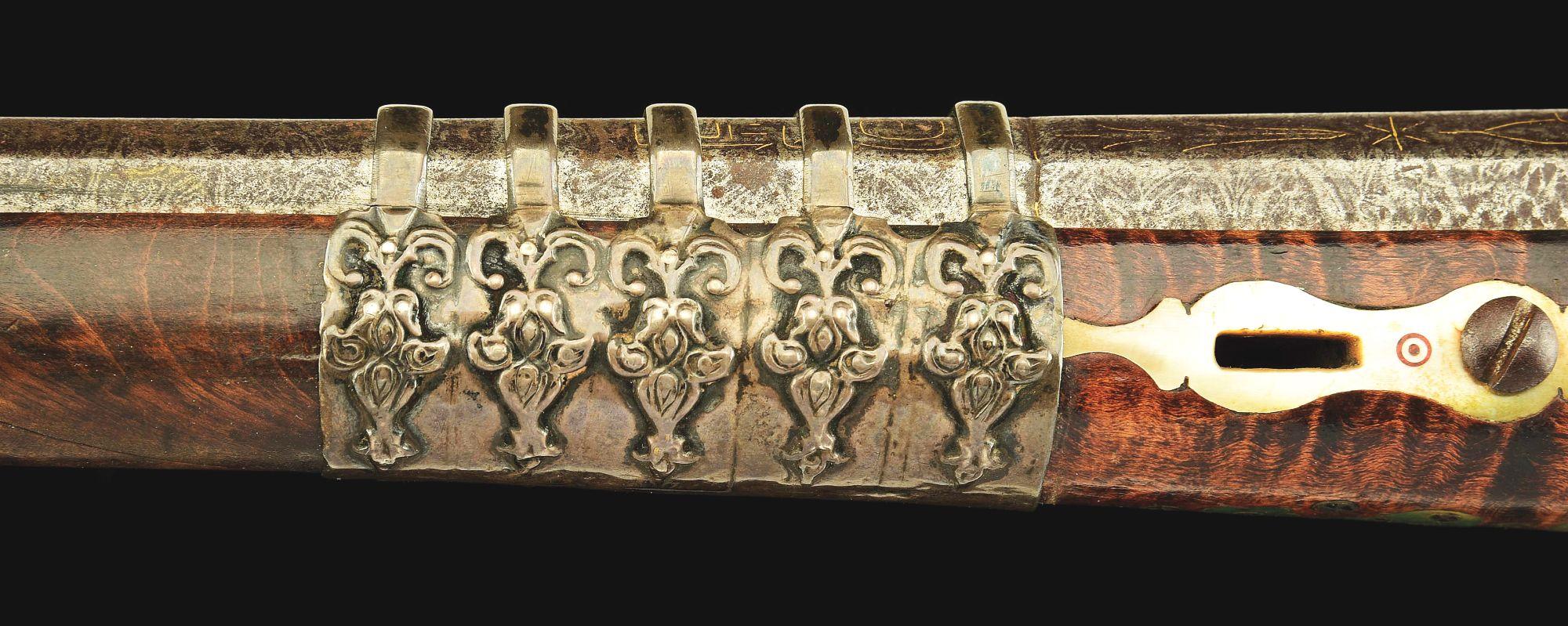 (A) AN ATTRACTIVE AND HIGHLY DECORATED CAUCASIAN MIQUELET LOCK RIFLE.