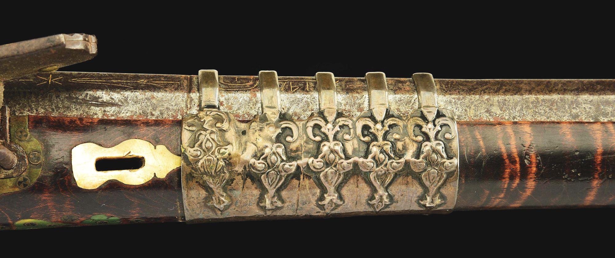 (A) AN ATTRACTIVE AND HIGHLY DECORATED CAUCASIAN MIQUELET LOCK RIFLE.