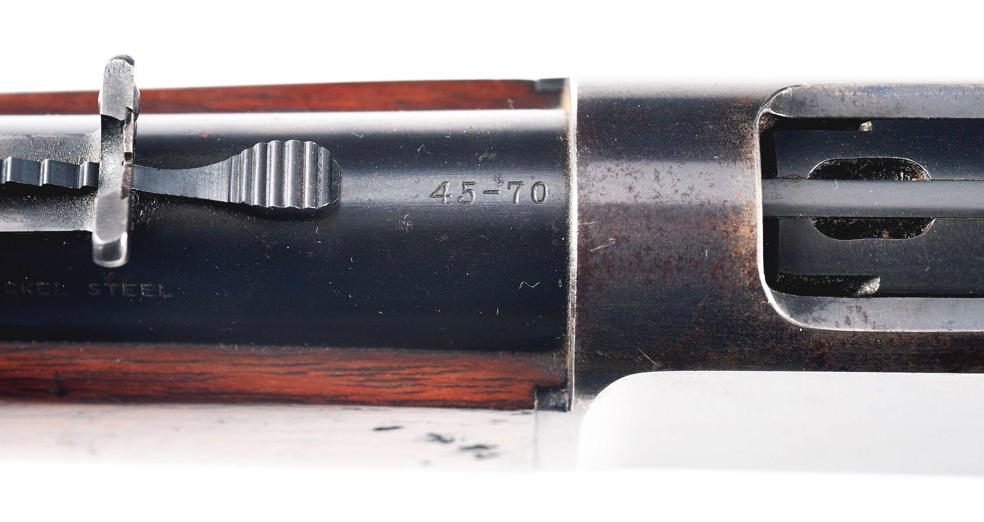 (C) WINCHESTER MODEL 1886 LEVER ACTION RIFLE.