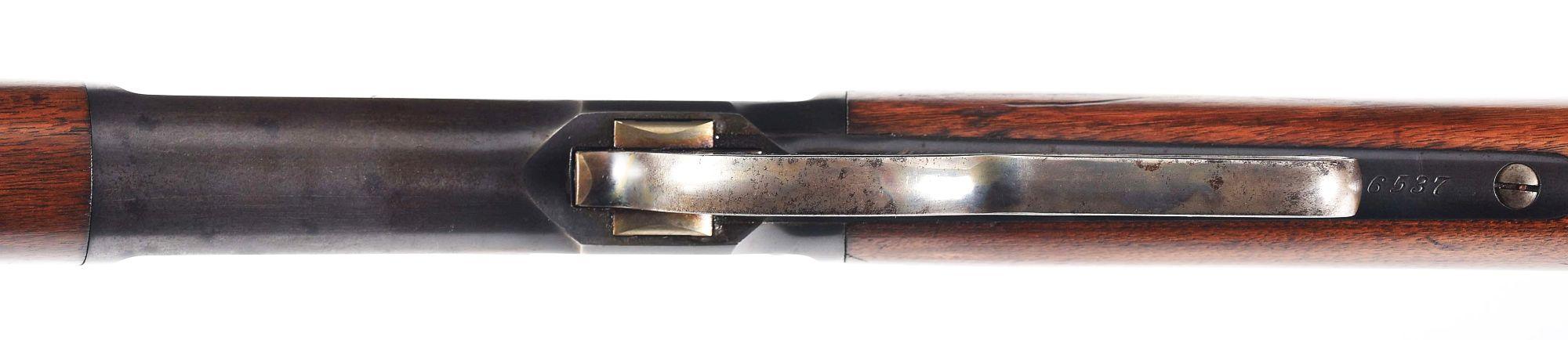 (C) WINCHESTER MODEL 1886 LEVER ACTION RIFLE.