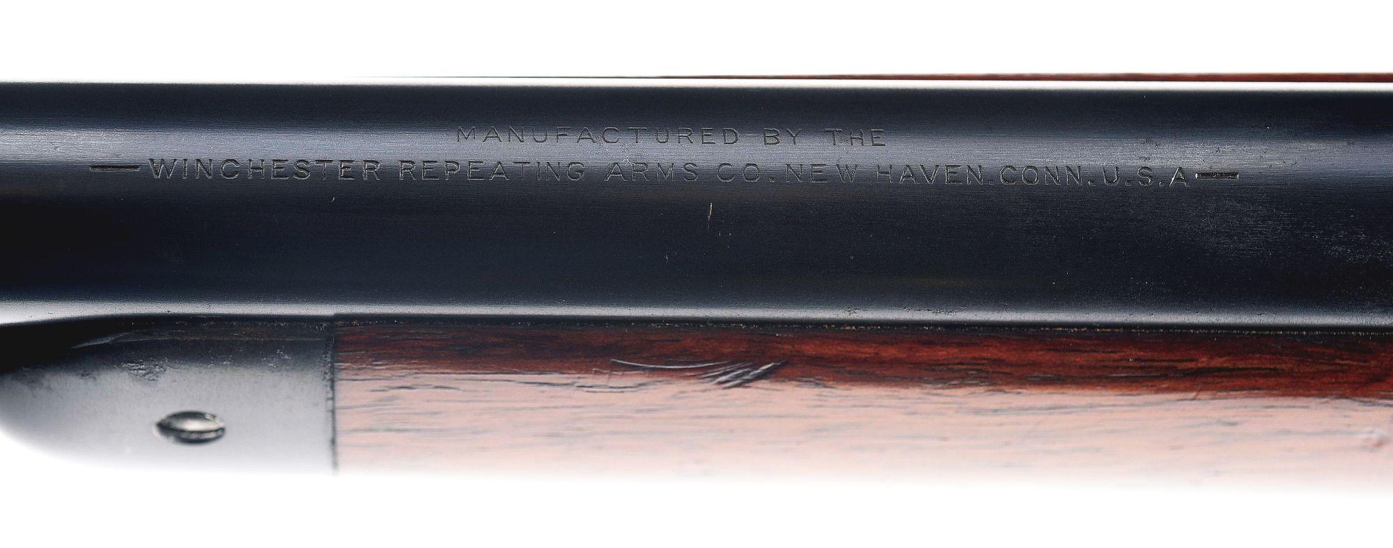 (C) WINCHESTER MODEL 1886 LEVER ACTION RIFLE.