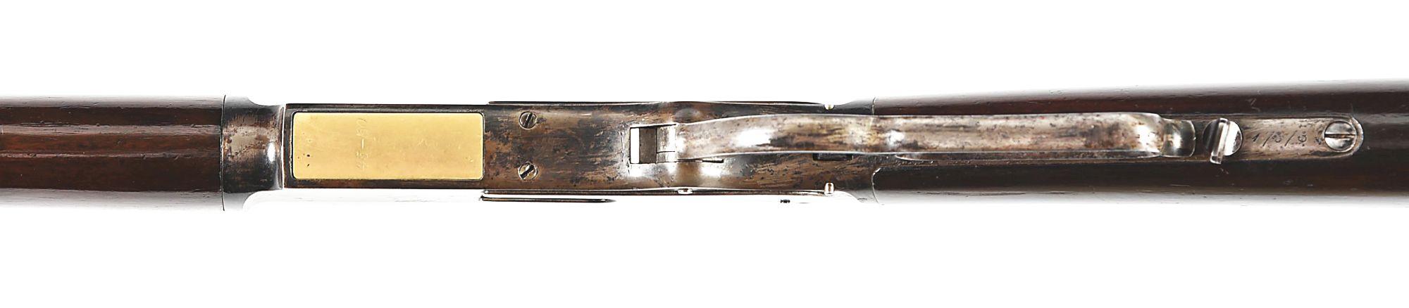 (A) WINCHESTER MODEL 1876 OPEN TOP LEVER ACTION RIFLE.