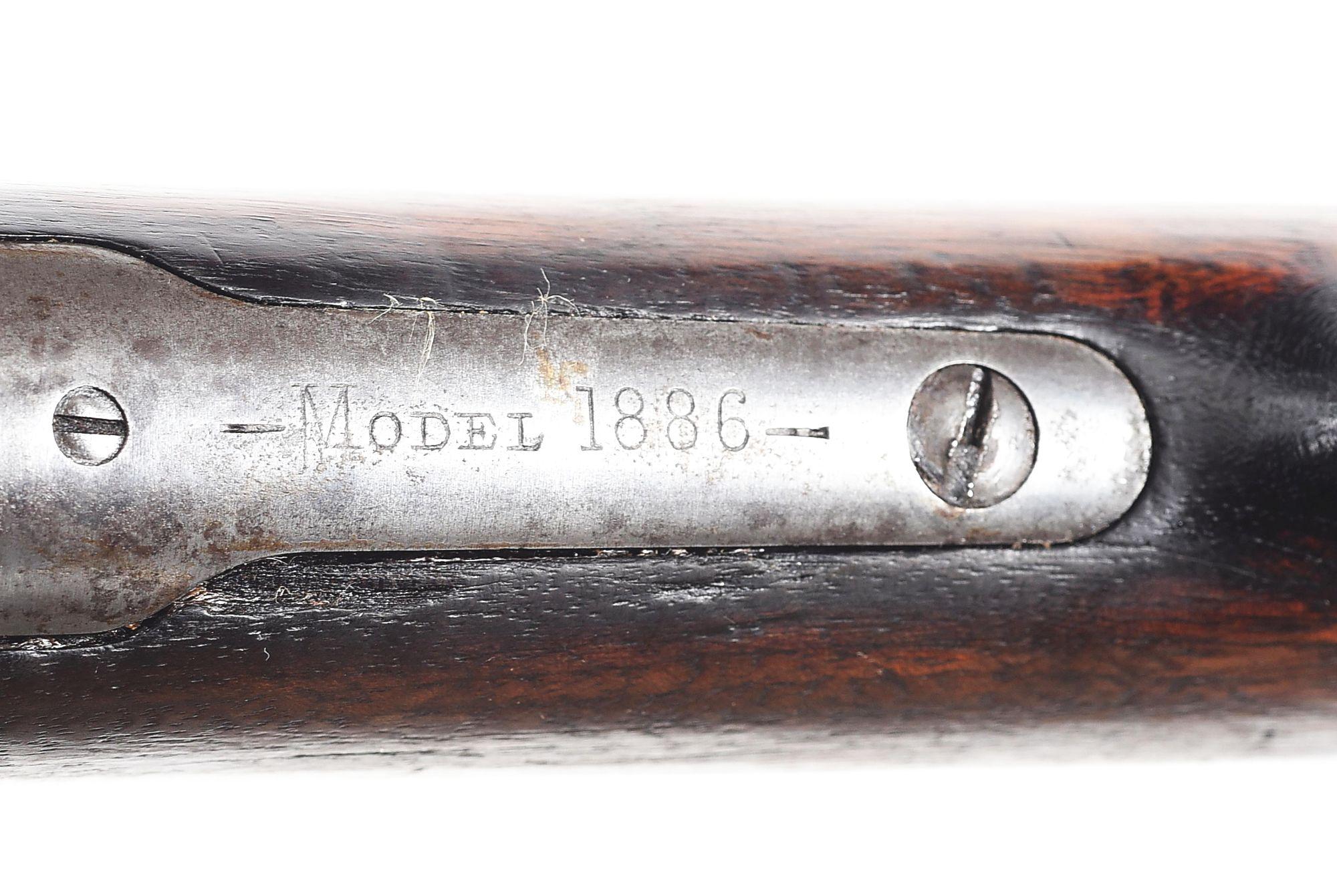 (A) WINCHESTER MODEL 1886 LEVER ACTION RIFLE IN .45-90.