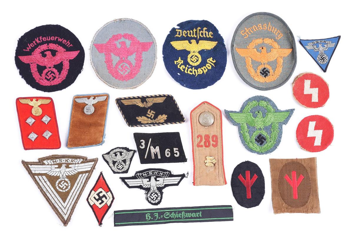 LOT OF THIRD REICH POLICE AND POLITICAL INSIGNIA.