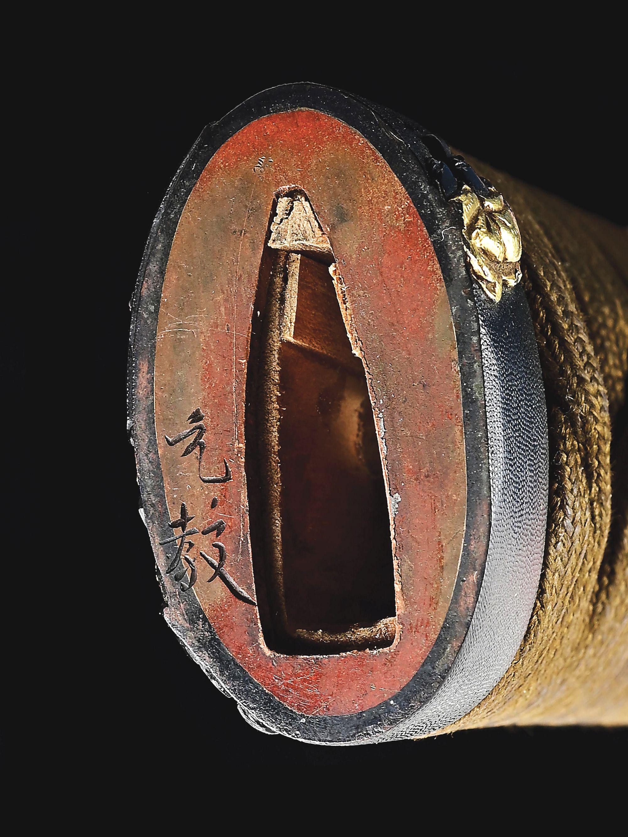 A LARGE TANTO SIGNED BY ECHIZEN KANETANE, WITH AN UNUSUAL INSCRIPTION REGARDING FORGING, IN KOSHIRAE