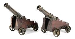 PAIR OF SIGNAL CANNONS ON CARRIAGES