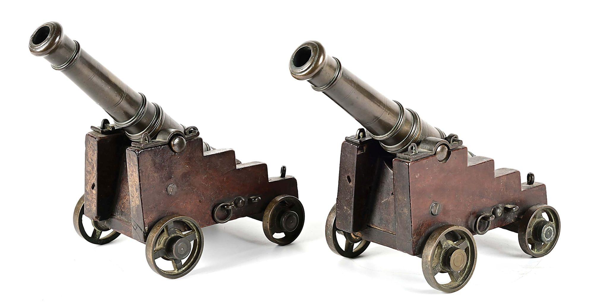 PAIR OF SIGNAL CANNONS ON CARRIAGES