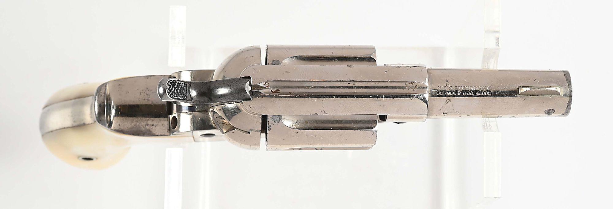 (A) COLT MODEL 1877 DOUBLE ACTION REVOLVER.