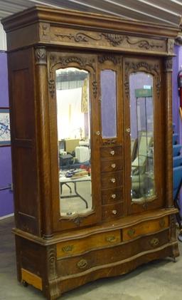 CIRCA 1900'S DOUBLE OAK WARDROBE W/BEVEL MIRRORS