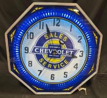 CHEVROLET LIGHTED ROTATING CLOCK - 18" x 18"