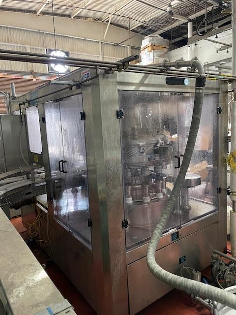 Palmer Rotary 12 Head Can Filler and DePalletizer