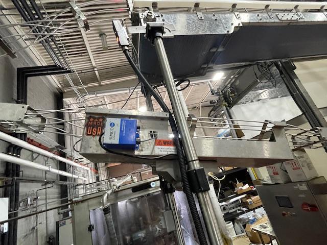 Palmer Rotary 12 Head Can Filler and DePalletizer