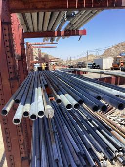 Shelf lot of assorted steel pipes
