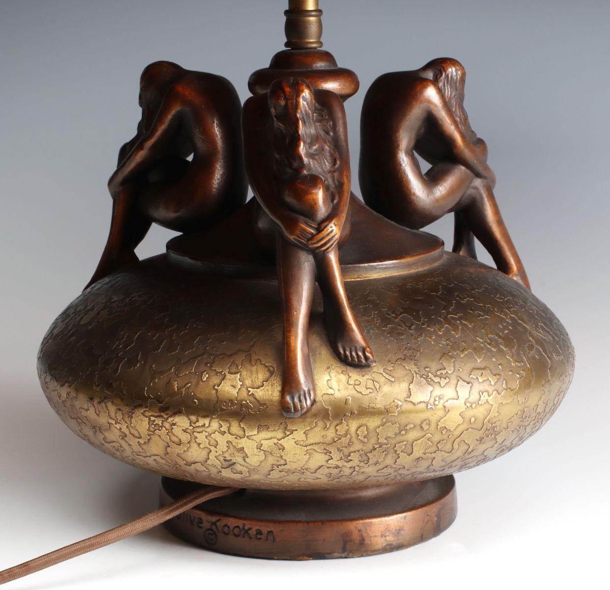 A POTTERY LAMP WITH NUDE FIGURES SIGNED OLIVE KOOKEN