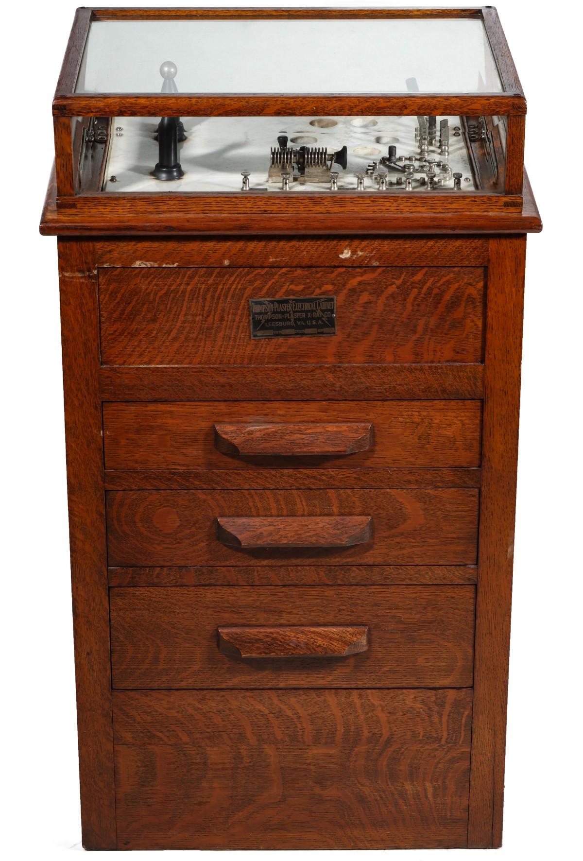 A THOMPSON PLASTER OAK ELECTRICAL CABINET QUACK DEVICE