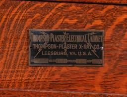 A THOMPSON PLASTER OAK ELECTRICAL CABINET QUACK DEVICE