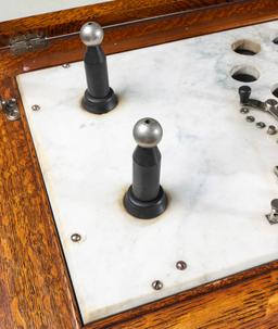 A THOMPSON PLASTER OAK ELECTRICAL CABINET QUACK DEVICE