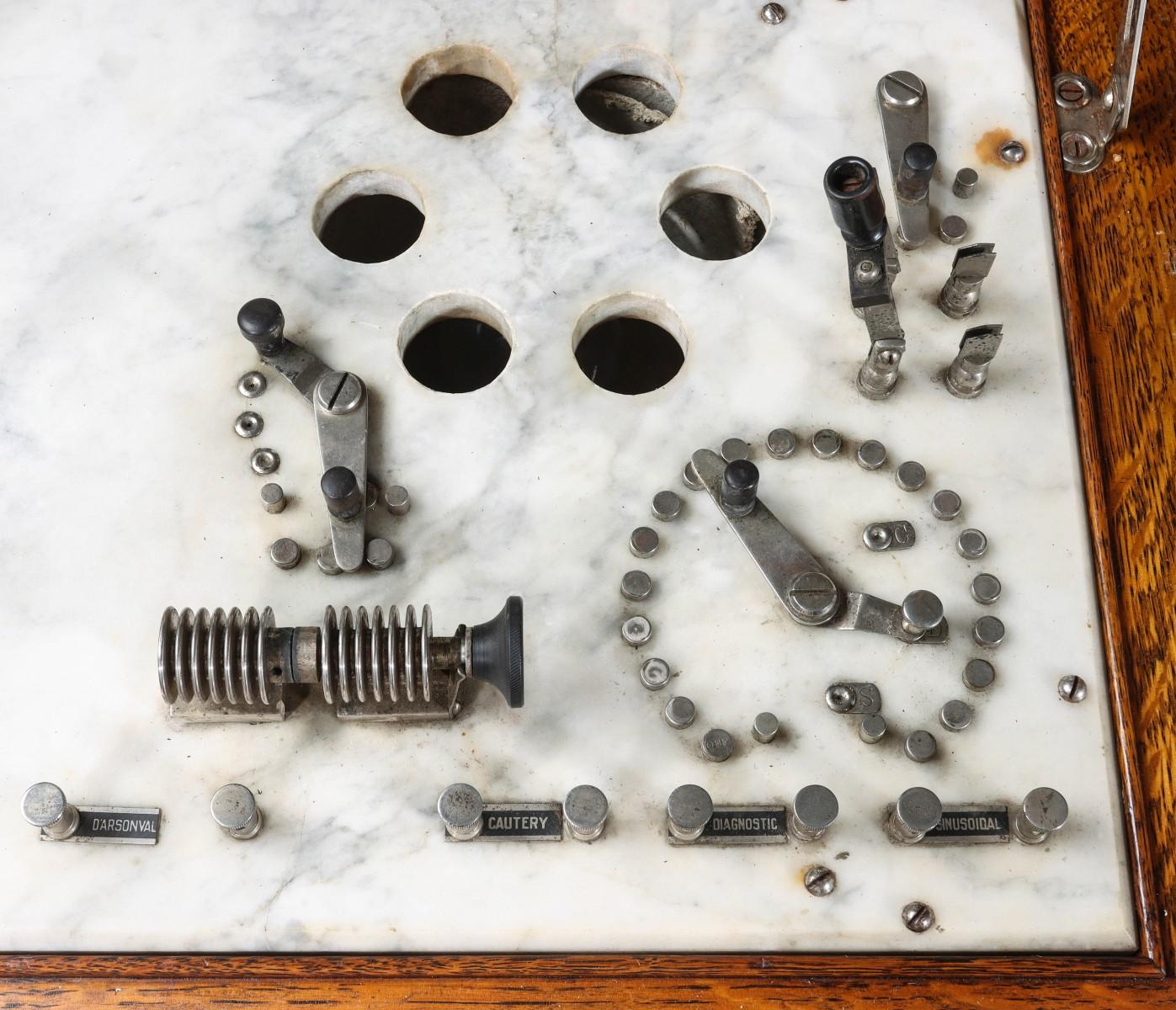 A THOMPSON PLASTER OAK ELECTRICAL CABINET QUACK DEVICE