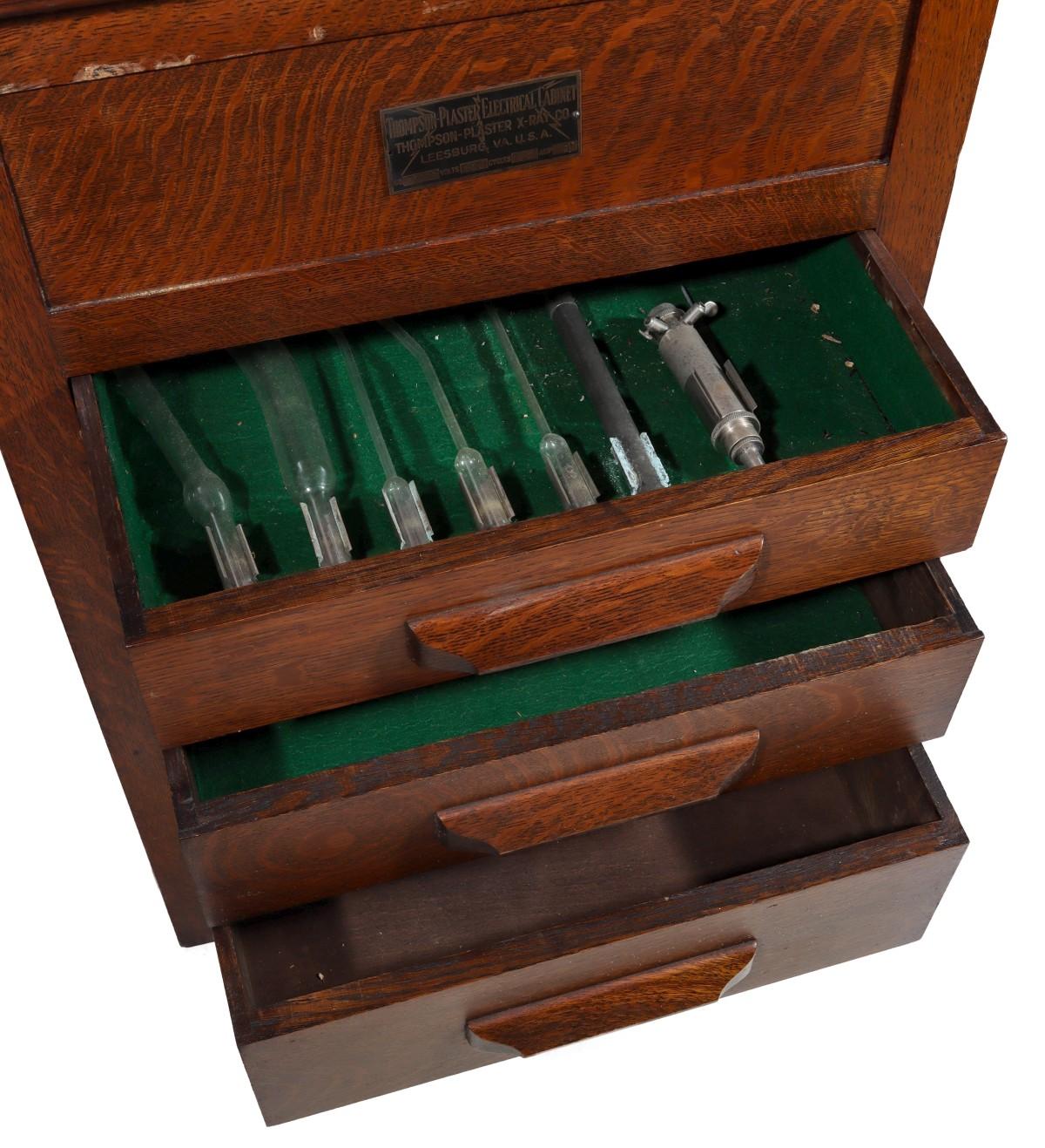 A THOMPSON PLASTER OAK ELECTRICAL CABINET QUACK DEVICE