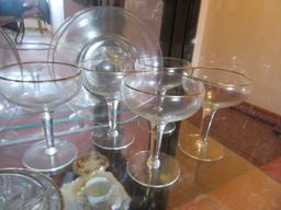 GOLD-RIMMED STEMWARE, POINSETTIA BOWL, AND PLATES