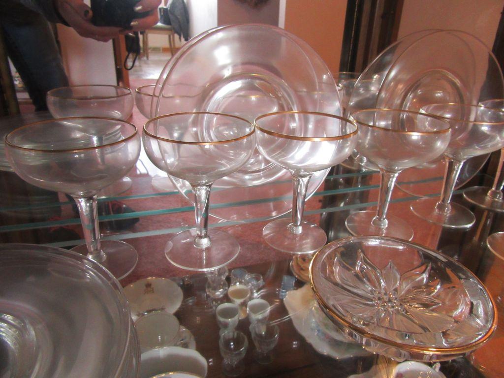 GOLD-RIMMED STEMWARE, POINSETTIA BOWL, AND PLATES