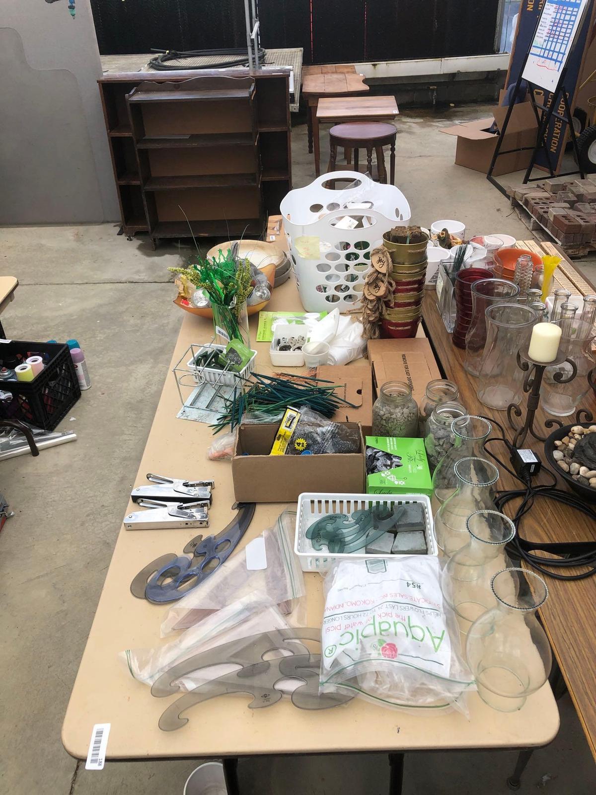 Lot of decorative items, florist items and Etc on top of table