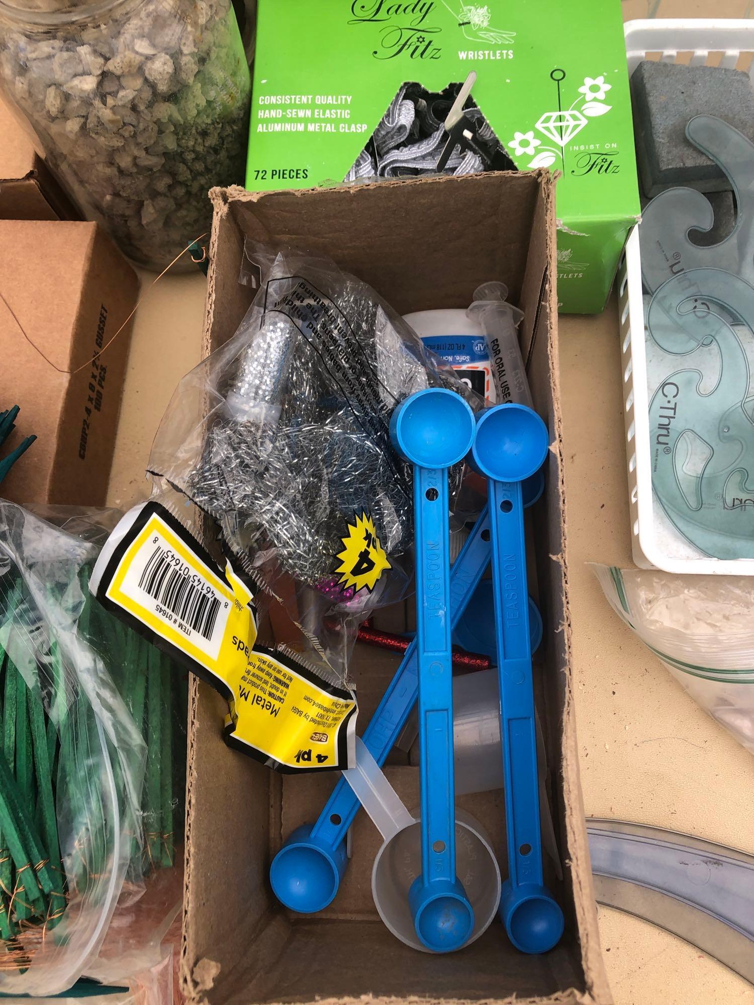 Lot of decorative items, florist items and Etc on top of table