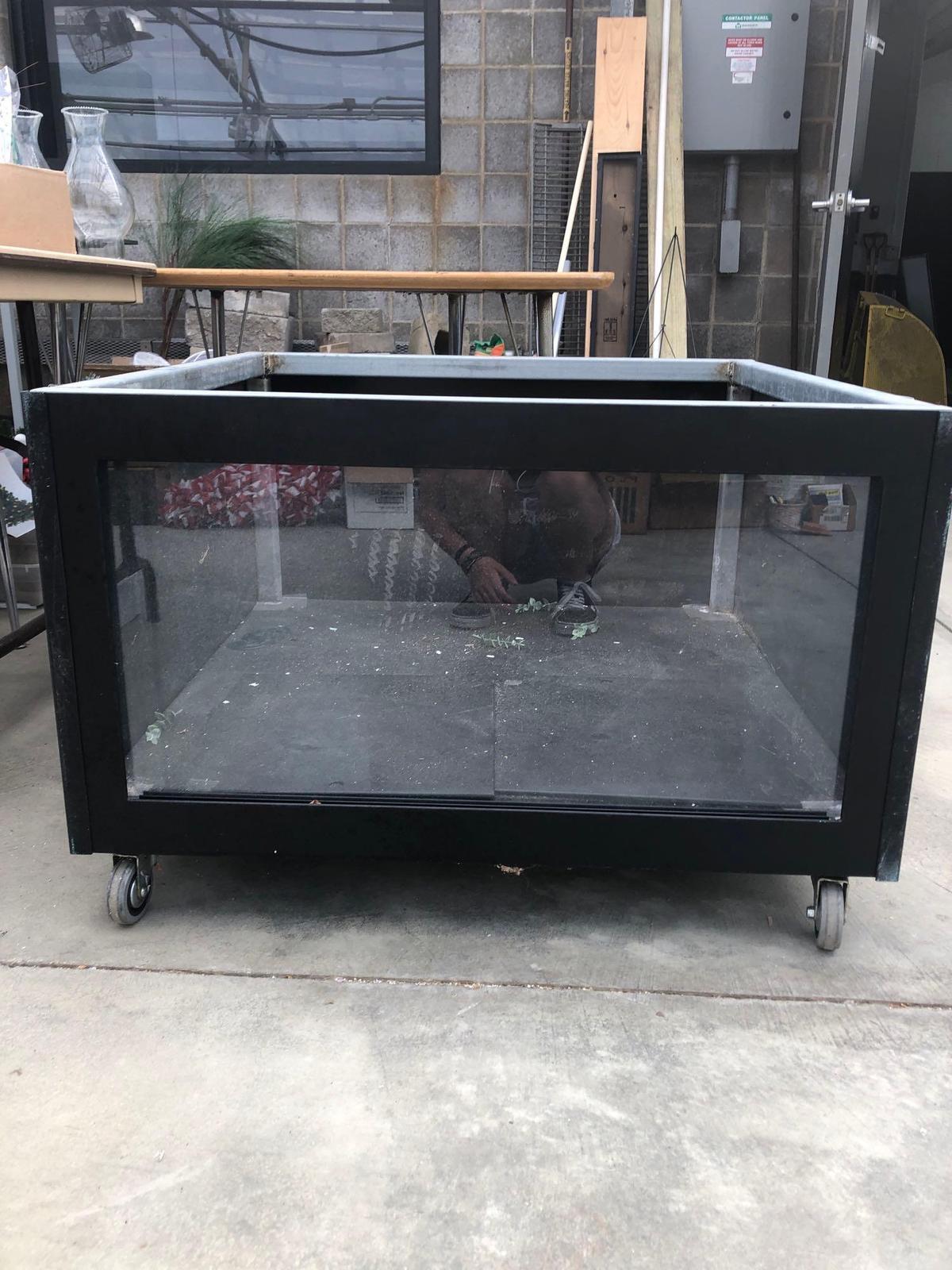 Heavy roll about cabinet with glass front