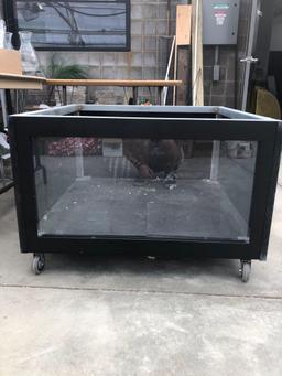 Heavy roll about cabinet with glass front