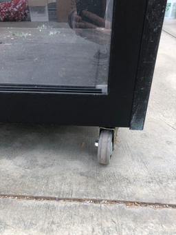 Heavy roll about cabinet with glass front
