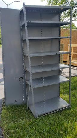 Two sets of metal adjustable shelving units. Approximately 7 ft tall by 3 ft long by 1 ft 6 in deep